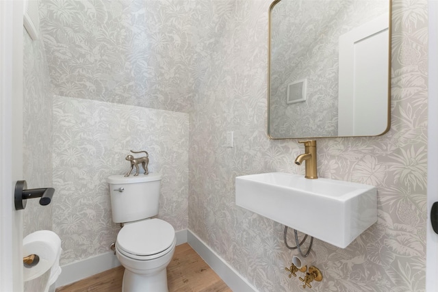 4516 Shenandoah Ave, University Park, TX 75205 - half bath with wood finished floors, toilet, a sink, and baseboards