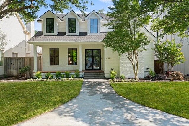 4516 Shenandoah Ave, University Park, TX 75205 - view of front facade featuring brick siding, a shingled roof, and covered porch