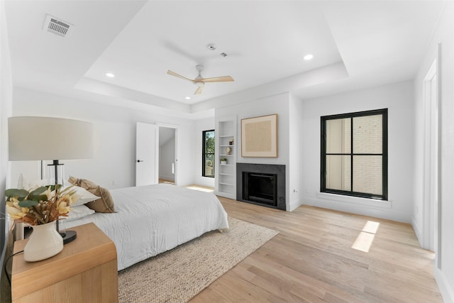 4516 Shenandoah Ave, University Park, TX 75205 - bedroom with a raised ceiling, light wood finished floors, recessed lighting, baseboards, and ceiling fan