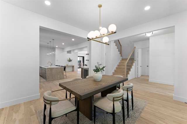 4516 Shenandoah Ave, University Park, TX 75205 - dining room featuring a chandelier, wine cooler, light wood-style flooring, stairway, and recessed lighting