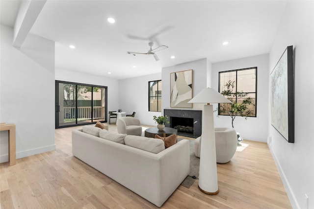 4516 Shenandoah Ave, University Park, TX 75205 - living area with a high end fireplace, light wood-style floors, recessed lighting, baseboards, and ceiling fan