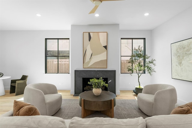 4516 Shenandoah Ave, University Park, TX 75205 - living room with light wood finished floors, ceiling fan, recessed lighting, and a premium fireplace