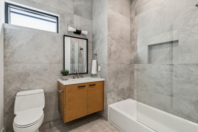 2031 Cullen Ave, Dallas, TX 75206 - bathroom featuring tile walls, vanity, toilet, and washtub / shower combination