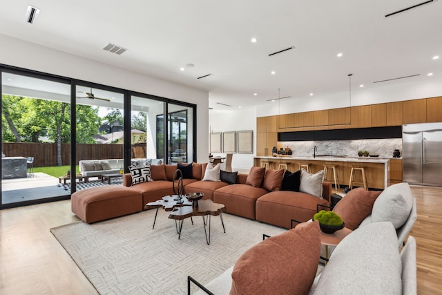 2031 Cullen Ave, Dallas, TX 75206 - living room featuring recessed lighting and light wood-style floors