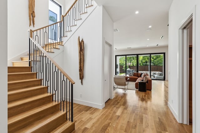 2031 Cullen Ave, Dallas, TX 75206 - staircase featuring wood finished floors, recessed lighting, and baseboards