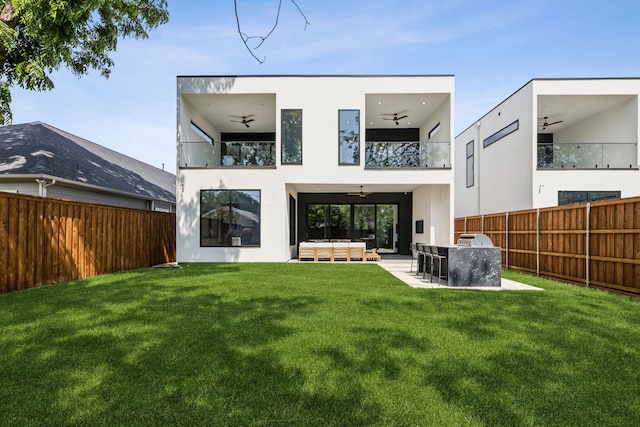 2031 Cullen Ave, Dallas, TX 75206 - rear view of house featuring a balcony, ceiling fan, stucco siding, and an outdoor living space