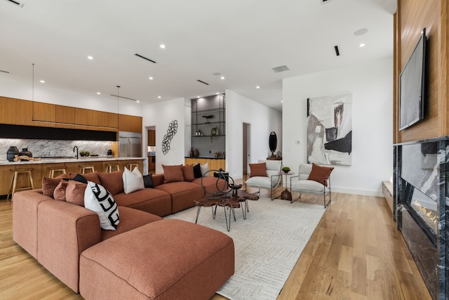 2031 Cullen Ave, Dallas, TX 75206 - living room with light wood finished floors, recessed lighting, and baseboards