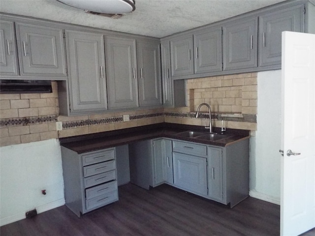 337 W Coral Way, Grand Prairie, TX 75051 - kitchen with a sink, gray cabinets, tasteful backsplash, and dark wood finished floors