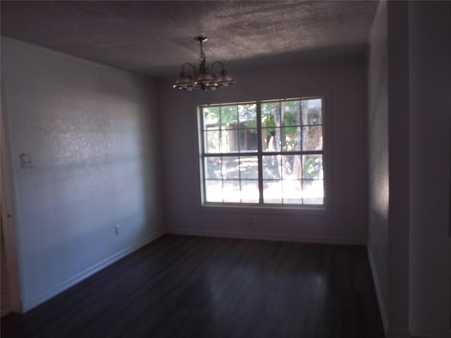 337 W Coral Way, Grand Prairie, TX 75051 - unfurnished dining area with a chandelier, dark wood-type flooring, and baseboards