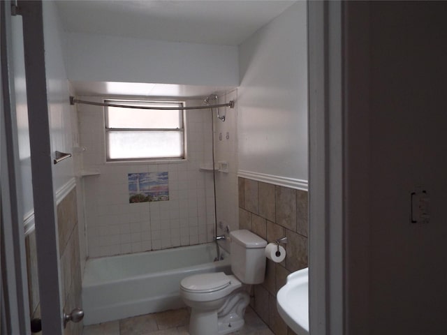 337 W Coral Way, Grand Prairie, TX 75051 - full bathroom with  shower combination, tile walls, toilet, and a wainscoted wall