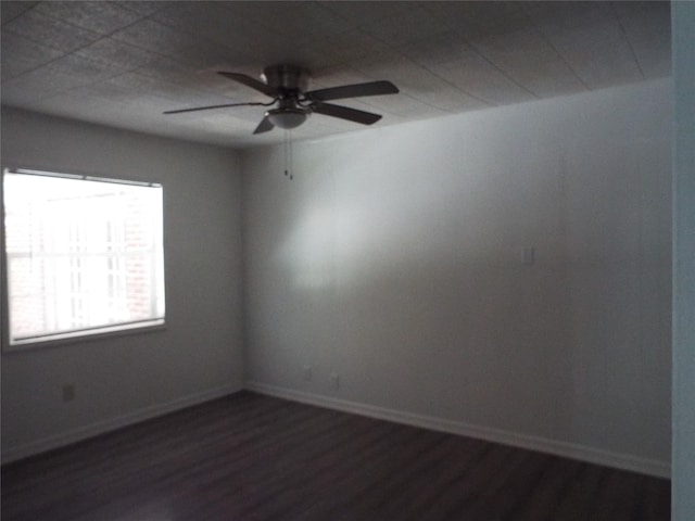337 W Coral Way, Grand Prairie, TX 75051 - spare room featuring dark wood-style floors, a ceiling fan, and baseboards