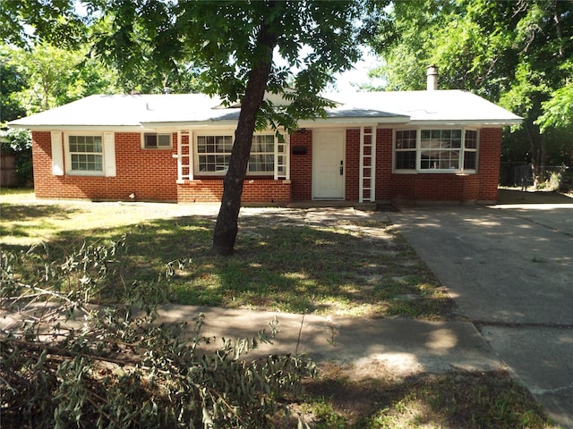 337 W Coral Way, Grand Prairie, TX 75051 - ranch-style house with concrete driveway and brick siding