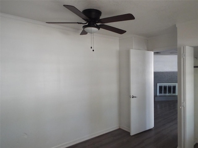337 W Coral Way, Grand Prairie, TX 75051 - empty room with dark wood-type flooring, a ceiling fan, ornamental molding, and baseboards