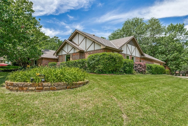 2831 Creekwood Ct, Grapevine, TX 76051 - view of home's exterior with brick siding and a lawn