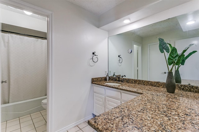 2831 Creekwood Ct, Grapevine, TX 76051 - full bath with tile patterned floors, vanity, toilet, baseboards, and shower / tub combo