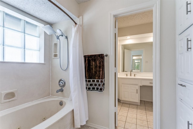 2831 Creekwood Ct, Grapevine, TX 76051 - full bath featuring tile patterned flooring, a combined bath / shower with jetted tub, vanity, a textured ceiling, and baseboards