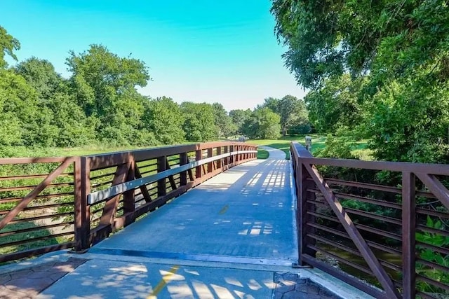 2831 Creekwood Ct, Grapevine, TX 76051 - surrounding community with a wooded view
