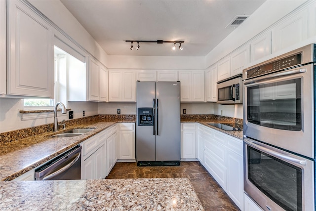 2831 Creekwood Ct, Grapevine, TX 76051 - kitchen with stainless steel appliances, a sink, and white cabinetry