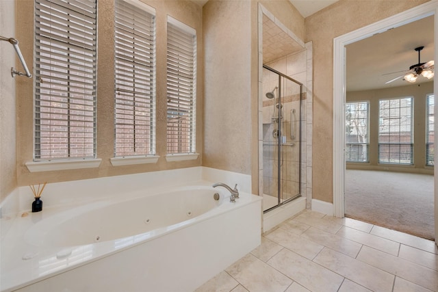1542 Sandia Ln, Frisco, TX 75033 - full bathroom featuring a jetted tub, a stall shower, ceiling fan, a textured wall, and tile patterned floors