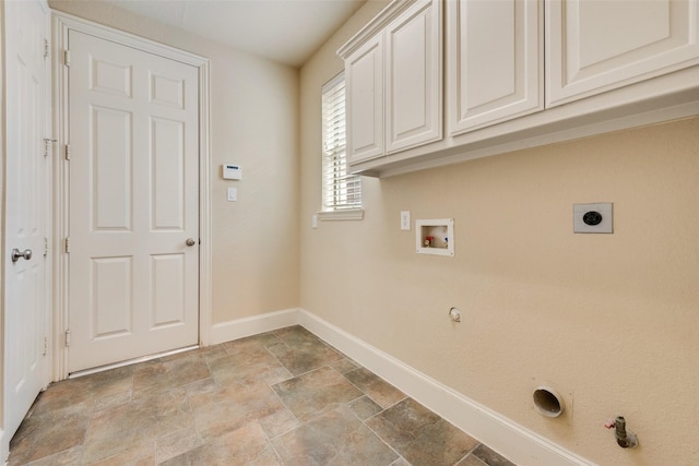 1542 Sandia Ln, Frisco, TX 75033 - laundry area featuring hookup for a gas dryer, cabinet space, baseboards, light stone finish floors, and electric dryer hookup