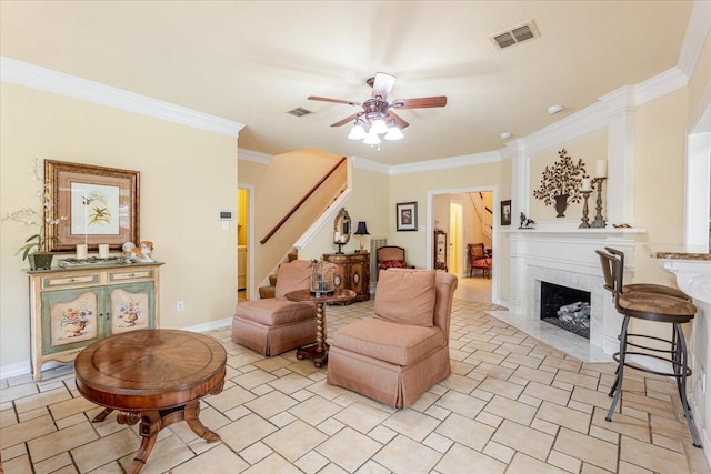 6717 Savannah Ln, Fort Worth, TX 76132 - living room with stairway, a ceiling fan, crown molding, a fireplace, and baseboards