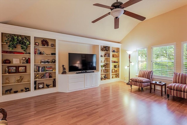 6717 Savannah Ln, Fort Worth, TX 76132 - living area with built in shelves, light wood-type flooring, a ceiling fan, baseboards, and high vaulted ceiling