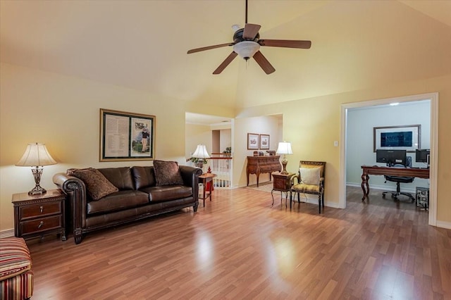 6717 Savannah Ln, Fort Worth, TX 76132 - living room with wood finished floors, a ceiling fan, high vaulted ceiling, and baseboards