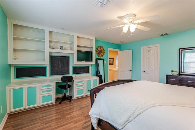 6717 Savannah Ln, Fort Worth, TX 76132 - bedroom with wood finished floors, an office area, a ceiling fan, and baseboards
