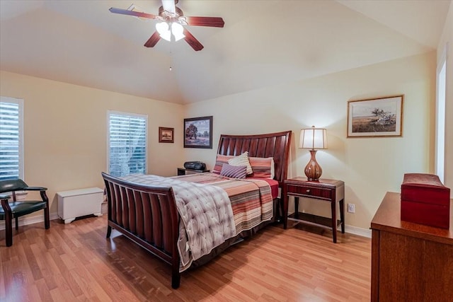 6717 Savannah Ln, Fort Worth, TX 76132 - bedroom with light wood-style flooring, baseboards, multiple windows, and vaulted ceiling