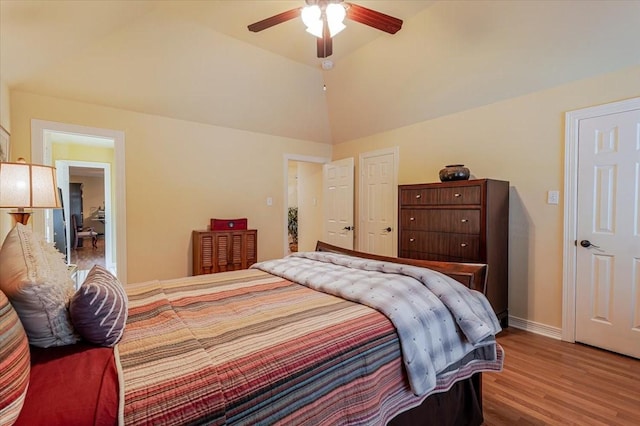 6717 Savannah Ln, Fort Worth, TX 76132 - bedroom with wood finished floors, lofted ceiling, baseboards, and ceiling fan