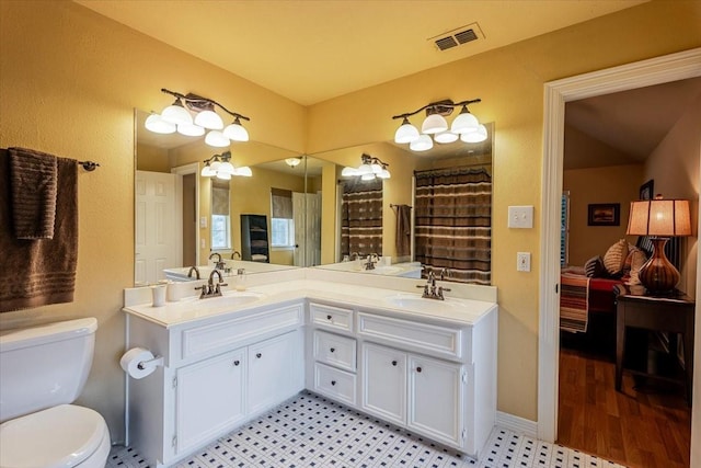 6717 Savannah Ln, Fort Worth, TX 76132 - full bathroom featuring double vanity, toilet, and baseboards
