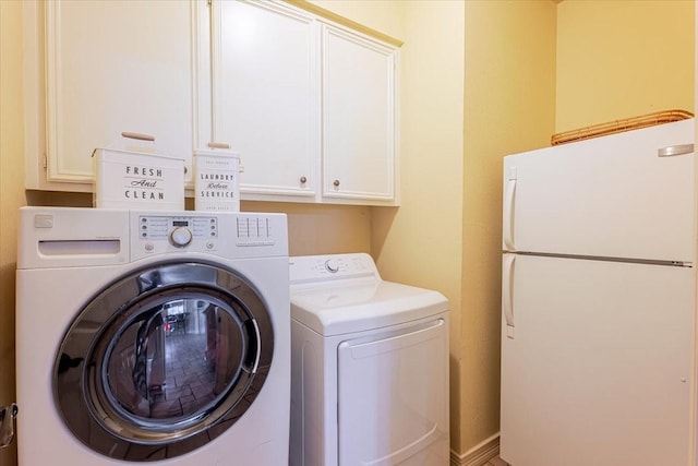 6717 Savannah Ln, Fort Worth, TX 76132 - washroom with washing machine and dryer and cabinet space