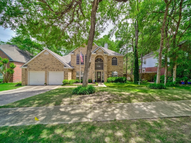 525 Sir Roland Dr, Grand Prairie, TX 75052 - traditional-style house featuring brick siding, a garage, concrete driveway, and a chimney