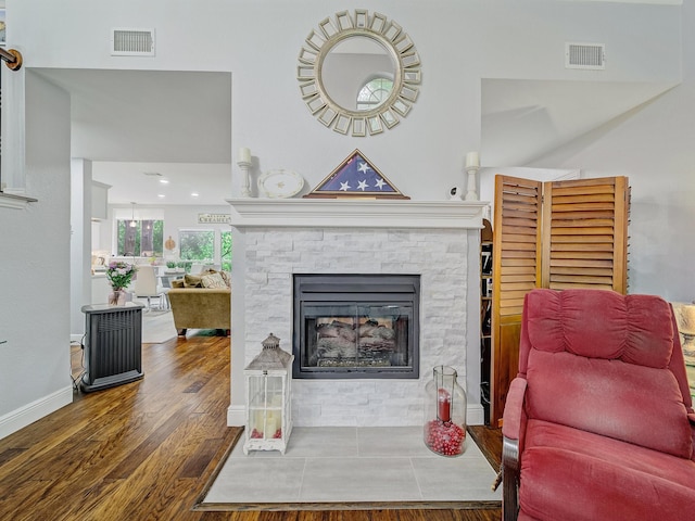 525 Sir Roland Dr, Grand Prairie, TX 75052 - living area with wood finished floors, a fireplace, and baseboards