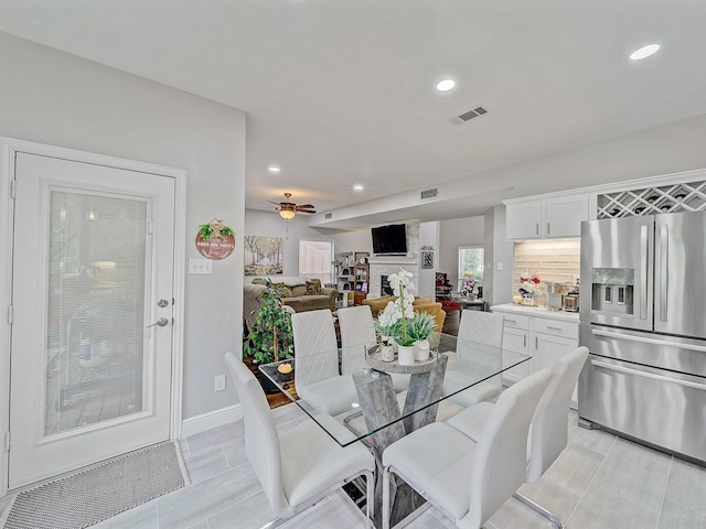 525 Sir Roland Dr, Grand Prairie, TX 75052 - dining room with recessed lighting, a large fireplace, a ceiling fan, and baseboards