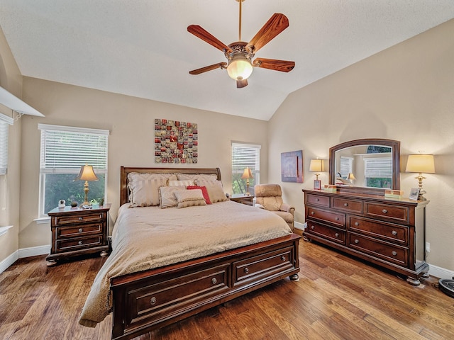 525 Sir Roland Dr, Grand Prairie, TX 75052 - bedroom featuring vaulted ceiling, dark wood-style flooring, baseboards, and a ceiling fan