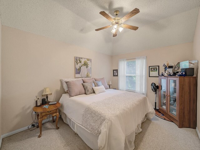 525 Sir Roland Dr, Grand Prairie, TX 75052 - bedroom with light colored carpet, a textured ceiling, vaulted ceiling, ceiling fan, and baseboards
