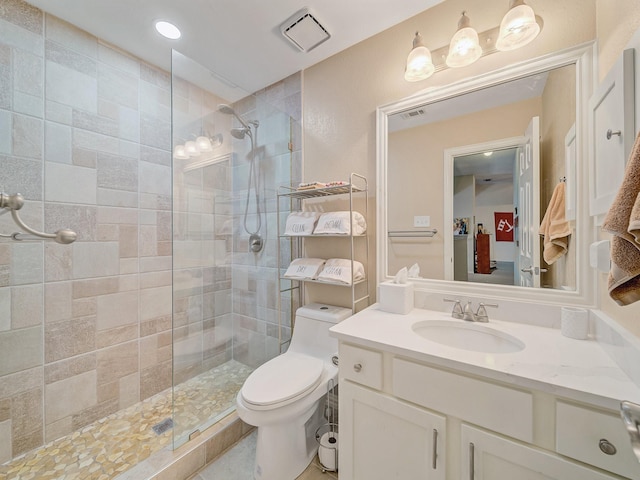 525 Sir Roland Dr, Grand Prairie, TX 75052 - bathroom featuring toilet, vanity, and a walk in shower