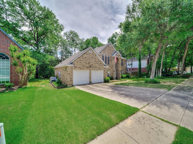 525 Sir Roland Dr, Grand Prairie, TX 75052 - traditional-style house featuring brick siding, a front lawn, concrete driveway, and a garage