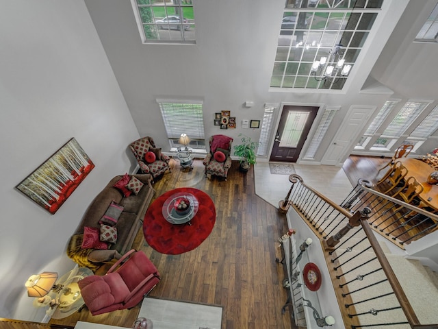 525 Sir Roland Dr, Grand Prairie, TX 75052 - entryway with a towering ceiling, a chandelier, hardwood / wood-style flooring, and stairs