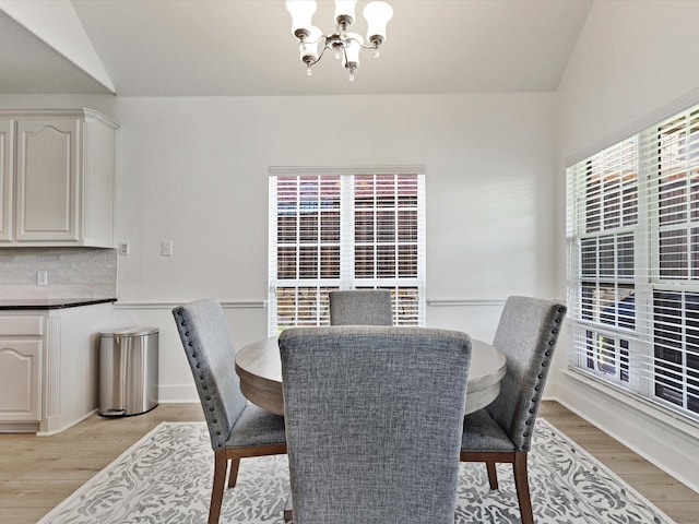 2231 Cold Water Dr, Prosper, TX 75078 - dining room featuring a chandelier, healthy amount of natural light, light wood-style floors, and lofted ceiling