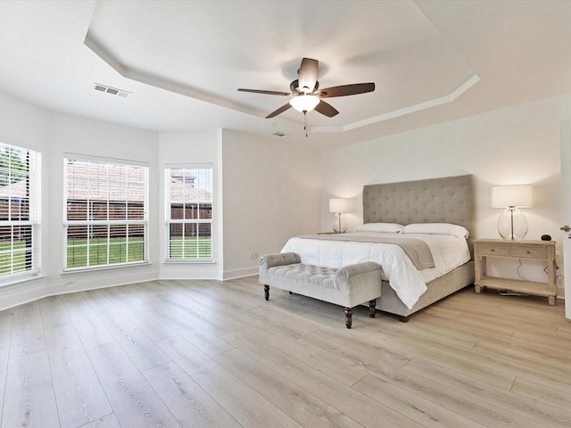 2231 Cold Water Dr, Prosper, TX 75078 - bedroom with a tray ceiling, light wood-style floors, ceiling fan, and baseboards