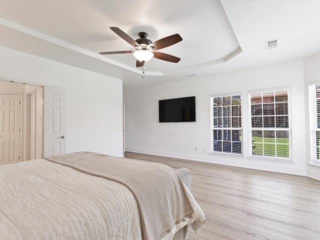 2231 Cold Water Dr, Prosper, TX 75078 - bedroom with a tray ceiling, wood finished floors, baseboards, and ceiling fan