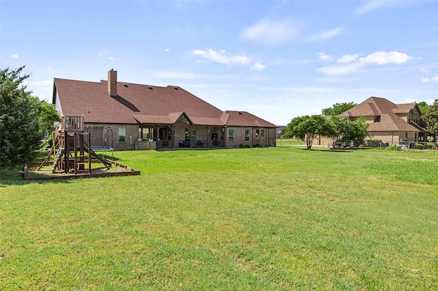 204 Lost Spur Ln, Royse City, TX 75189 - view of green lawn with a playground and a trampoline