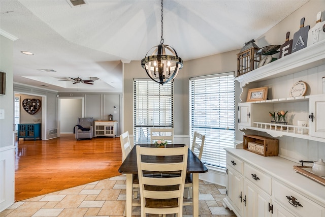 2332 Heatherwoods Way, Carrollton, TX 75007 - dining room with ceiling fan, a chandelier, healthy amount of natural light, and light wood-style floors