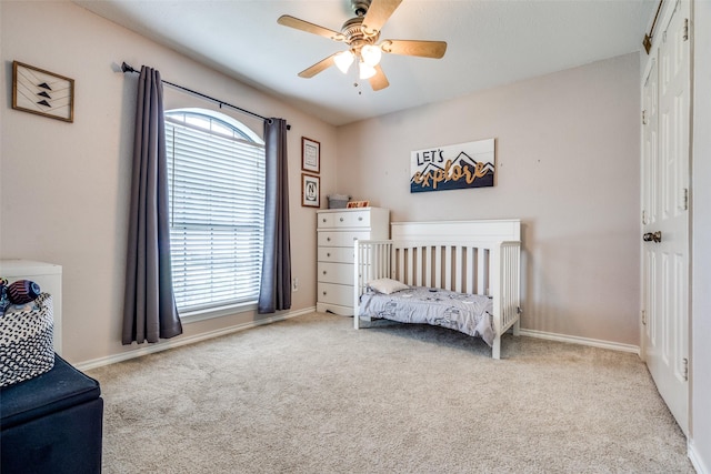 2332 Heatherwoods Way, Carrollton, TX 75007 - carpeted bedroom featuring multiple windows, baseboards, and ceiling fan