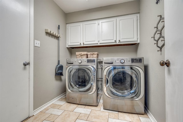2332 Heatherwoods Way, Carrollton, TX 75007 - laundry area featuring cabinet space, washing machine and dryer, baseboards, and light tile patterned floors