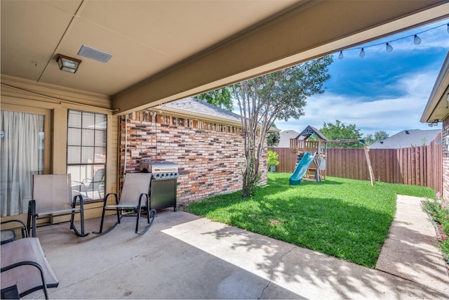 2332 Heatherwoods Way, Carrollton, TX 75007 - view of patio featuring a playground and area for grilling