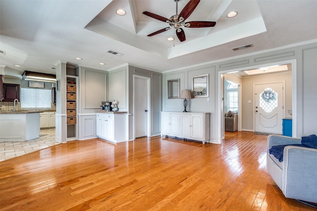 2332 Heatherwoods Way, Carrollton, TX 75007 - living area with ceiling fan, light wood-style floors, healthy amount of natural light, a decorative wall, and recessed lighting