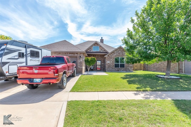 4709 Spring Creek Rd, Abilene, TX 79602 - view of front of property featuring brick siding, a garage, concrete driveway, and roof with shingles